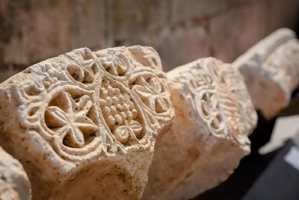 Ancient stone carvings with intricate floral designs.